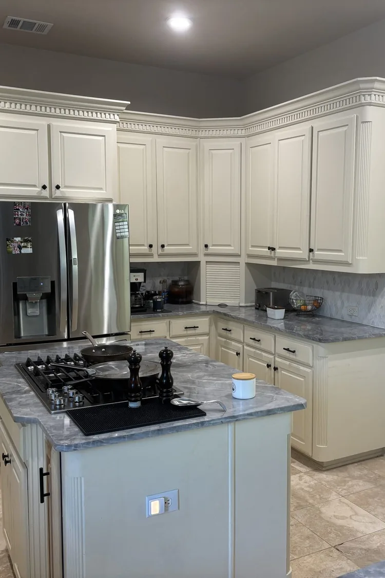 Kitchen cabinets repainted in warm cream by PG Painting