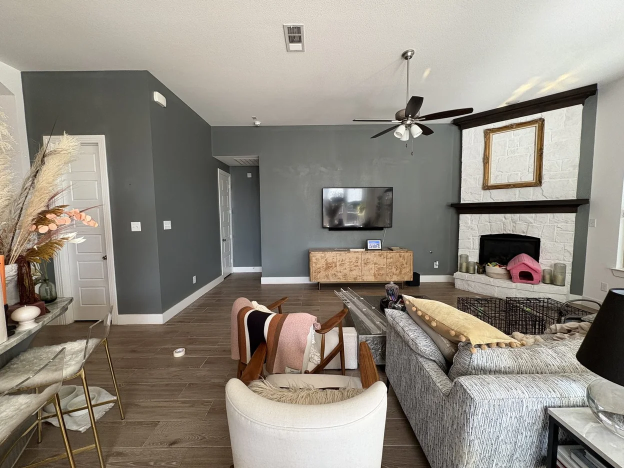 Living room repainted in a slate blue-gray by PG Painting