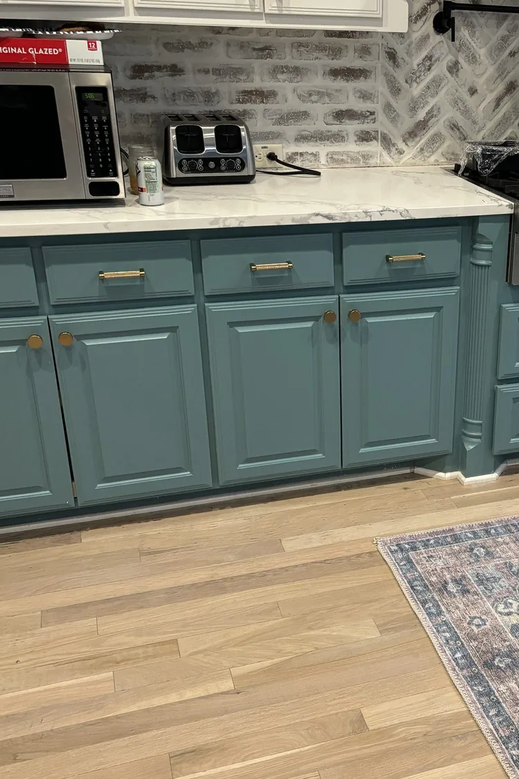 Kitchen cabinets refinished in sage green by PG Painting