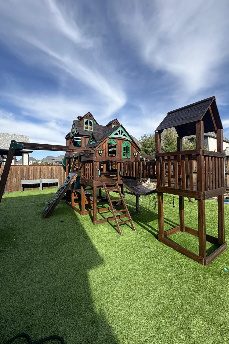 Backyard wooden playset stained and sealed by PG Painting