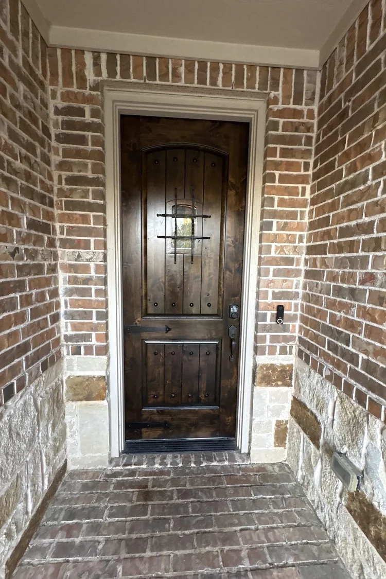 Wood entry door in a rich dark stain by PG Painting